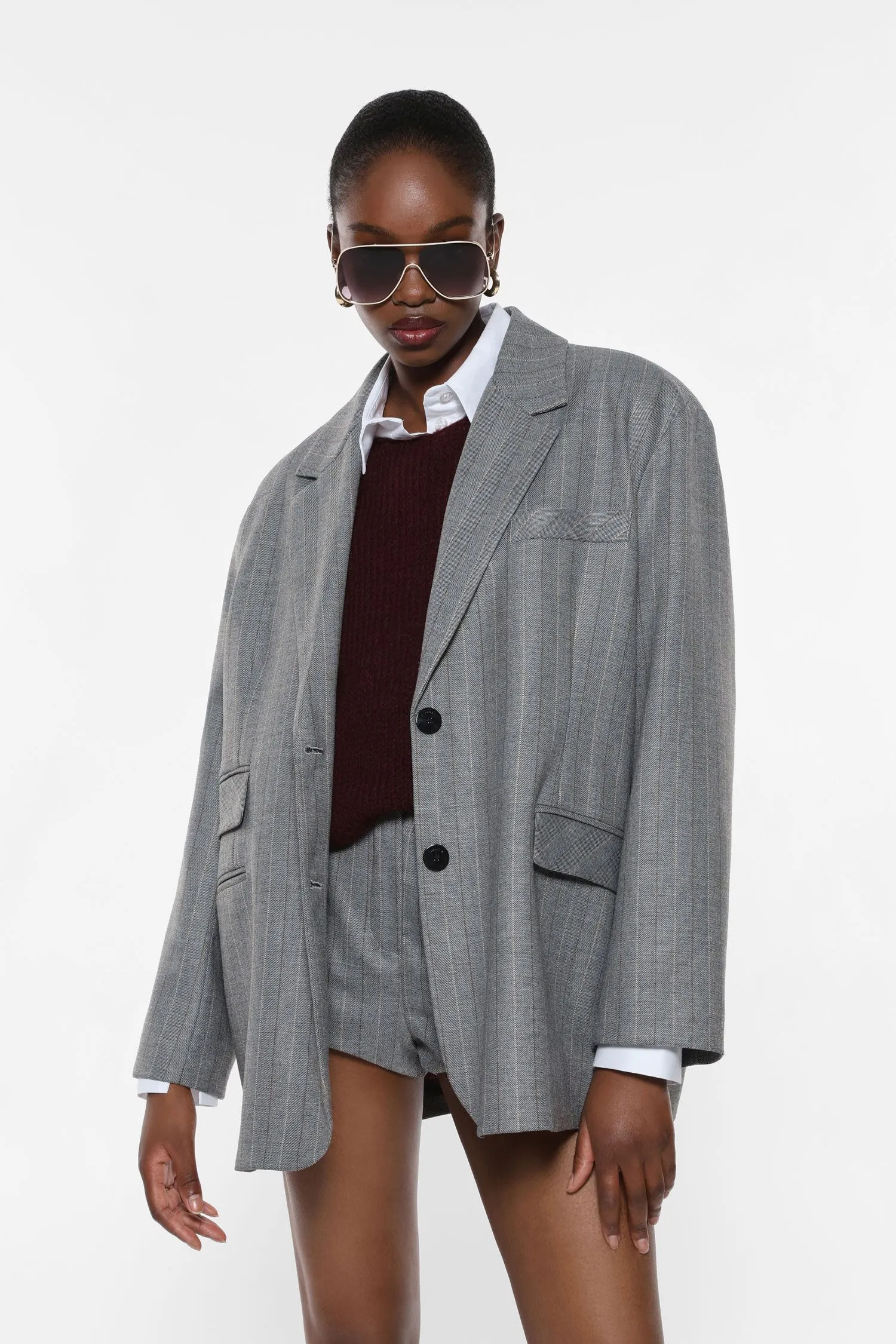  Blazer gessato con tasche a pattina     