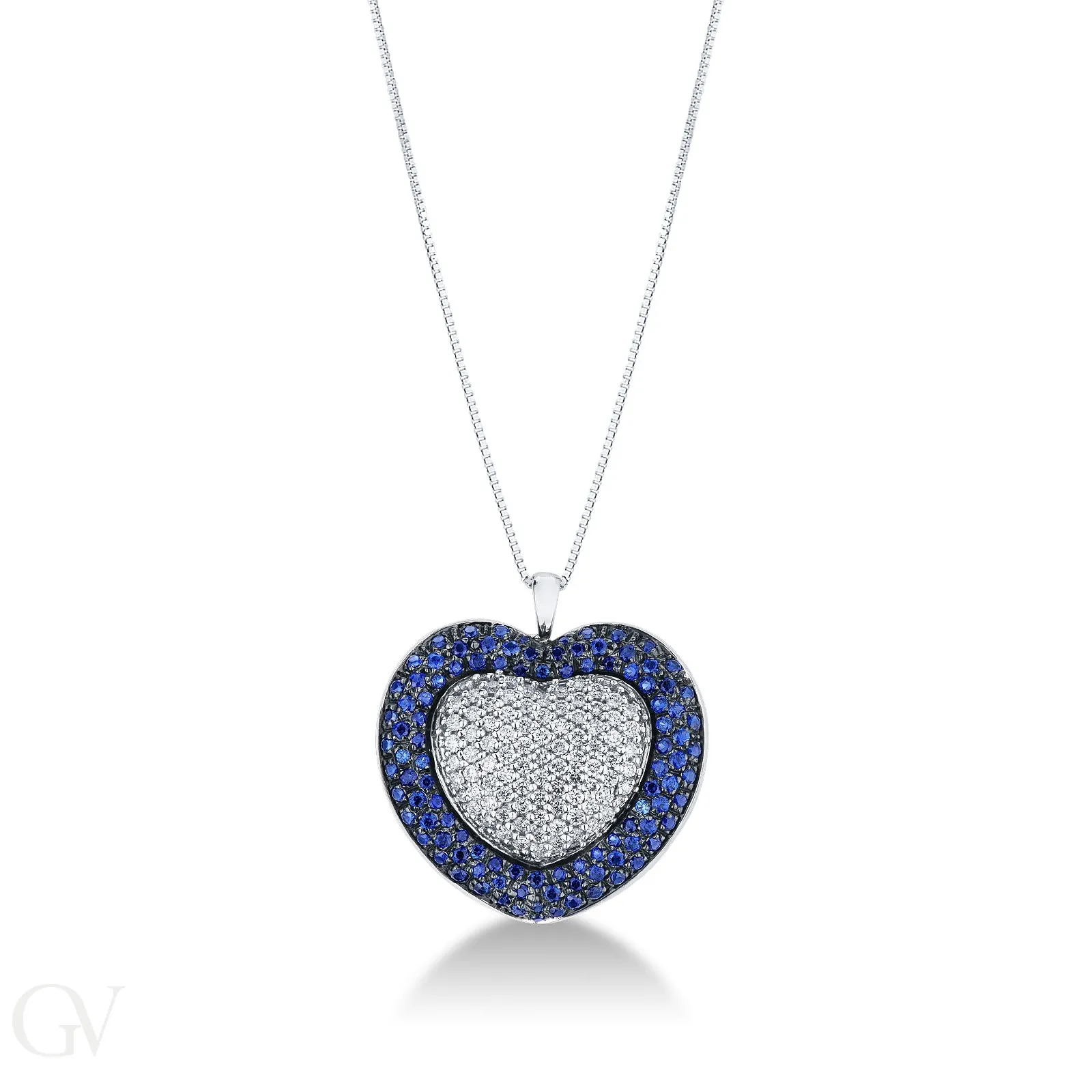 Collana in oro bianco 18k con ciondolo a cuore in diamanti e zaffiri blu